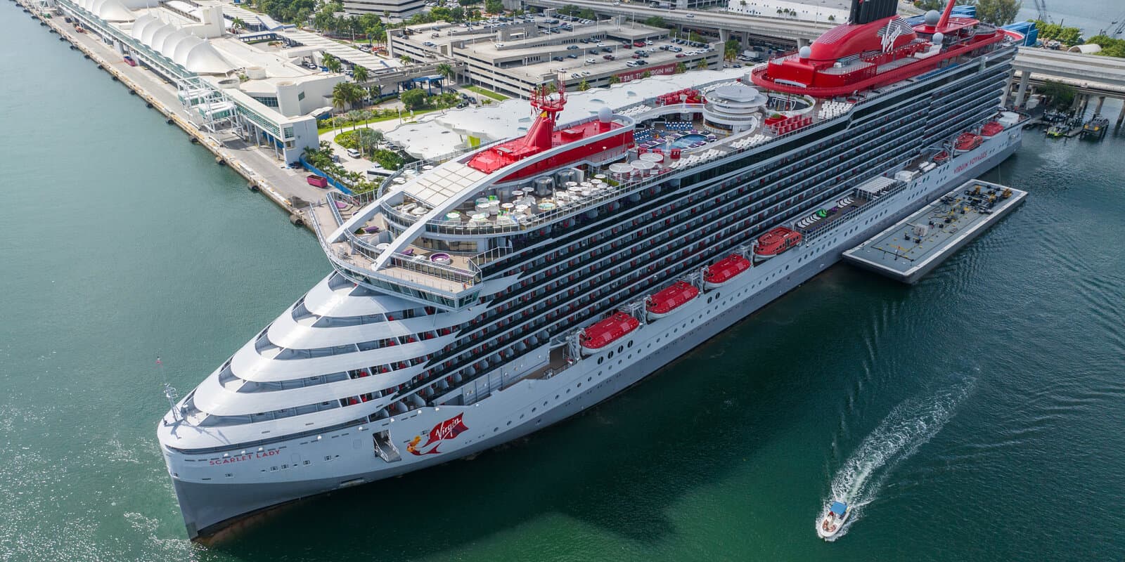 Scarlet Lady cruise ship docked at the Miami cruise terminal on a sunny day